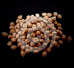 Chickpeas on black background TheÂ chickpeaÂ or chick pea (Cicer arietinum) is an annual legume of the family Fabacea